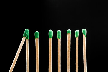 matches standing in a row on black background  - Image