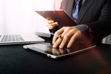 businessman holding coins putting in glass and using calculator. concept saving money and finance accounting.