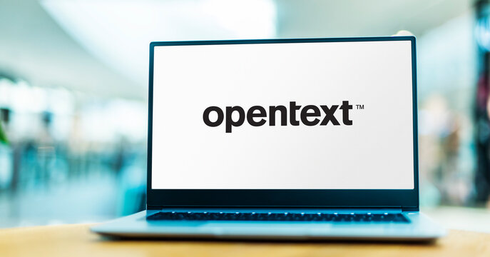 Laptop computer displaying logo of OpenText