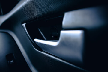 Inner car door handle. The inner side of the door in the car