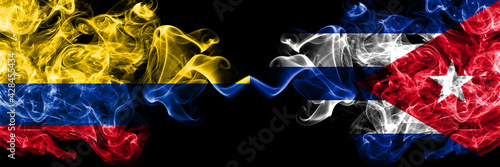Colombia, Colombian vs Cuba, Cuban smoky mystic flags placed side by side. Thick colored silky abstract smokes flags.