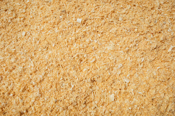 Natural dry shavings background. Wood dust texture. Sawdust backdrop. Top view. Wood industry concept. Eco energy design. Copy space