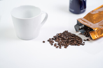 Coffee Beans on the white background with cup