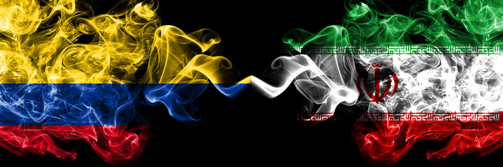 Colombia, Colombian vs Iran, Iranian smoky mystic flags placed side by side. Thick colored silky...