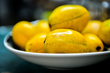 bolw of cajá mango brazilian fruit ,Spondias dulcis ,black background, Spondias dulcis, cajá, cajarana, taperebá-do-sertão, cajá-dwarf, Anacardiaceae, ripe fruit,  exotic plant,  Spondias cythera