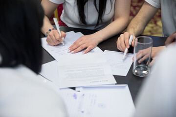 team working holding papers