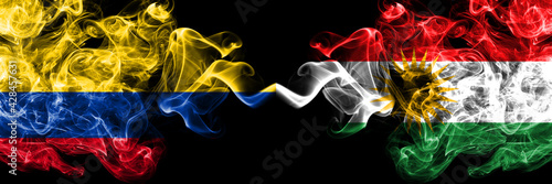 Colombia, Colombian vs Kurdistan, Kurdish, Kurds smoky mystic flags placed side by side. Thick colored silky abstract smokes flags.