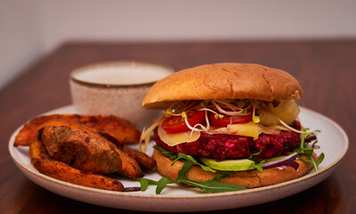 Veggie Burger Beet Root with Fries on white plate