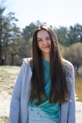 portrait of happy young woman at park. High quality photo