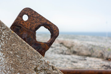 Rusted Metal Hole on Rock