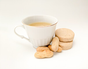 cup of marzipan atole on white background