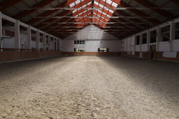 Obraz premium Photo of an empty indoor riding hall for horses and riders
