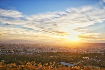 slowshutter photo shot of beautiful panoramic view of moving cloud with sunset on the top of mount...