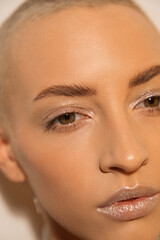 Fascinating girl having nude makeup posing isolated over white background