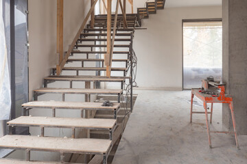 Renovated room with a stairs. Freshly built building from inside. Premises under construction are...