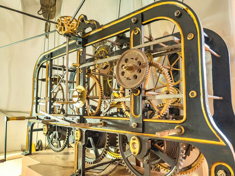 Clock mechanism in building. Mechanical big tower clock mechanism from inside. Mechanism of old clock inside view. Machinery with a lot of gears.