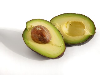 halves of cut avocado fruits close up