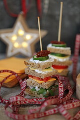 Colorful party sandwiches with vegan cheese and vegetables