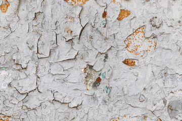 Old white cracked paint on a rusty metal plate. Texture background.