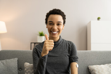 Woman Using Continuous Glucose Monitor