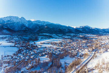 Cold morning over Zakopane town in Poland covered in snow with Mountains in the background. Aerial. High quality 4k footage