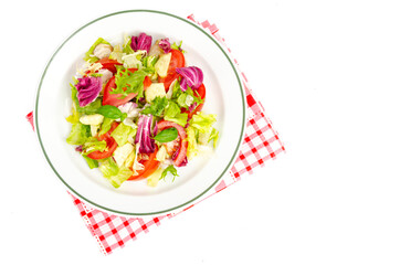 Plate with lettuce, tomatoes, olive oil. Vegetarian menu.