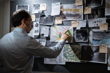 Policeman Searching Crime Investigation Board