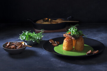 Rainbow trout, Oncorhynchus mykiss with skin, green pea puree, baked new potatoes and creamy mushrooms embellished with young fresh pea plants