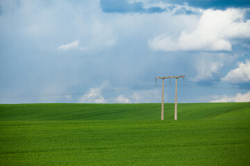 An electric pillar on green field