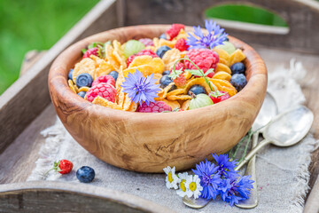 Summer fruits with cornflakes. Slimming and healthy breakfast.
