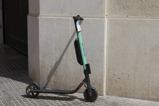 MALAGA, COSTA DEL SOL, SPAIN - AUGUST 29, 2019:
Electric scooters or e-scooters parked in the pedestrian zone - e-mobility or micro-mobility trend
