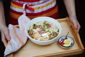 Pho Bo Sot Vang, vietnamese soup with slow cooking beef and rice noodle