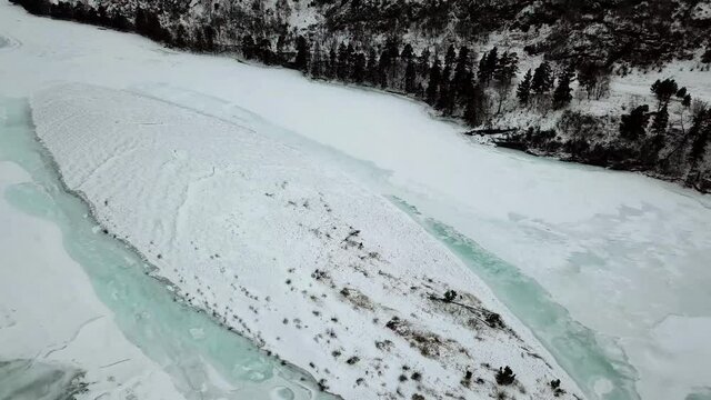 Mountain river in winter from a height