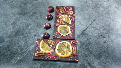 Obraz na płótnie Canvas Artisan handmade chocolate. Chocolate bars with dried fruit