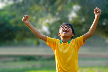 Excited boy football player after goal scored	 - Powered by Adobe