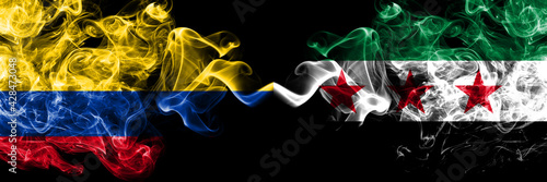 Colombia, Colombian vs Syria, Syrian Arab Republic, three stars smoky mystic flags placed side by side. Thick colored silky abstract smokes flags.