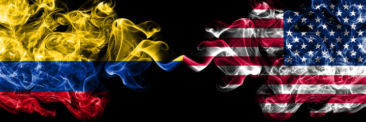 Colombia, Colombian vs United States of America, America, US, USA, American smoky mystic flags placed side by side. Thick colored silky abstract smokes flags.