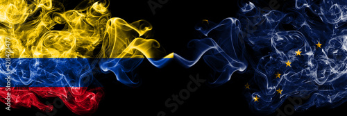Colombia, Colombian vs United States of America, America, US, USA, American, Alaska, Alaskan smoky mystic flags placed side by side. Thick colored silky abstract smokes flags.