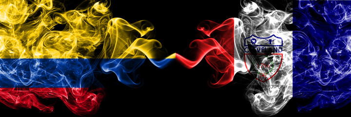 Colombia, Colombian vs United States of America, America, US, USA, American, Cleveland, Ohio smoky mystic flags placed side by side. Thick colored silky abstract smokes flags.