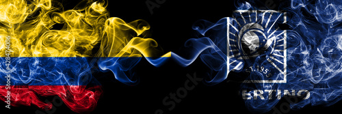 Colombia, Colombian vs United States of America, America, US, USA, American, Cupertino, California smoky mystic flags placed side by side. Thick colored silky abstract smokes flags.