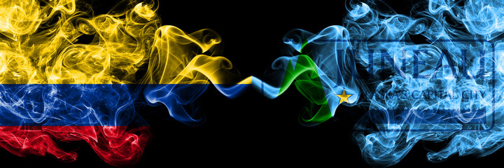 Colombia, Colombian vs United States of America, America, US, USA, American, Juneau, Alaska smoky mystic flags placed side by side. Thick colored silky abstract smokes flags.