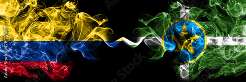 Colombia, Colombian vs United States of America, America, US, USA, American, Jackson, Mississippi smoky mystic flags placed side by side. Thick colored silky abstract smokes flags.