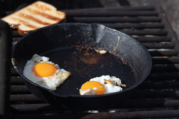 cooking breakfast on a cast iron skillet camping in idaho