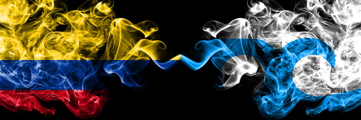 Colombia, Colombian vs United States of America, America, US, USA, American, Ocean City, Maryland smoky mystic flags placed side by side. Thick colored silky abstract smokes flags.