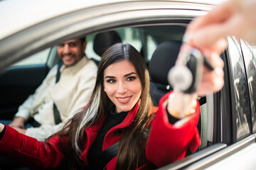 Fototapeta na wymiar Young woman taking her car keys