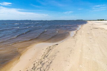 Sand and lake with blue sky