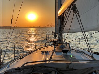Sunset in the harbor. Sunset on the sea. Yacht at sunset. 