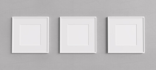 Three white square shape picture frames mockup