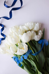 postcard layout. bouquet of tulips on white background and space for text 