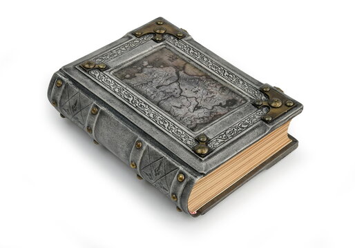Aged gray leather book with old map, brass corners and the frame lay down to the table isolated captured from the left side